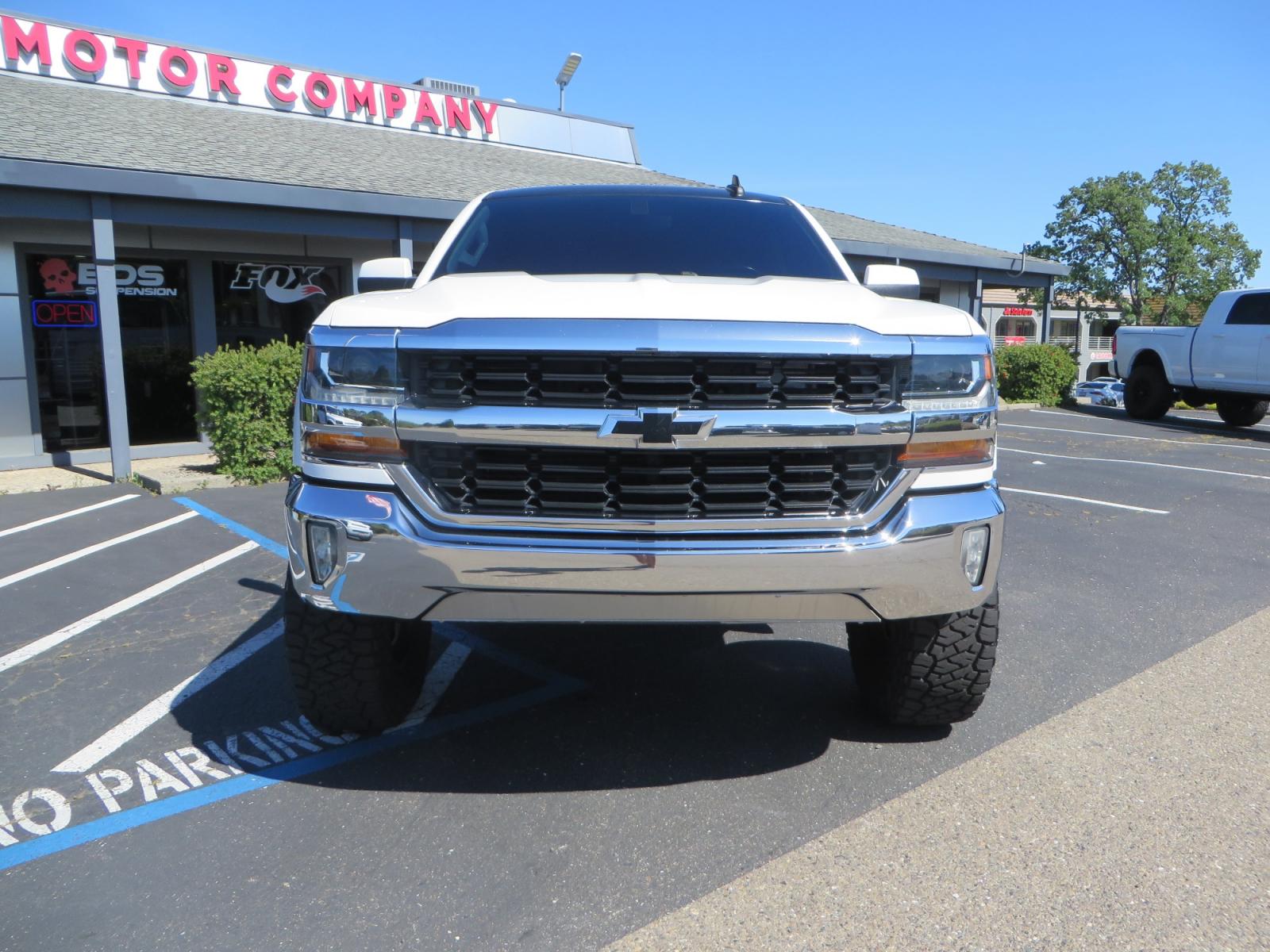2018 White /BLACK Chevrolet Silverado 1500 LT (3GCPCREC7JG) with an 5.3L V8 OHV 16V engine, automatic transmission, located at 2630 Grass Valley Highway, Auburn, CA, 95603, (530) 508-5100, 38.937893, -121.095482 - Must see Pre Runner.... CST front lift spindals, Camburg UCA's, King Adjustable 2.5 Coil-overs, King 2.5 rear shocks, 35" Toyo RT Trail tires, 17" Method Race wheels, MZ front skid plate, G2 rear differntail cover, Full size bed mounted spare tire, Black Vinyl roof wrap, smoke tail lights and 3rd br - Photo #1